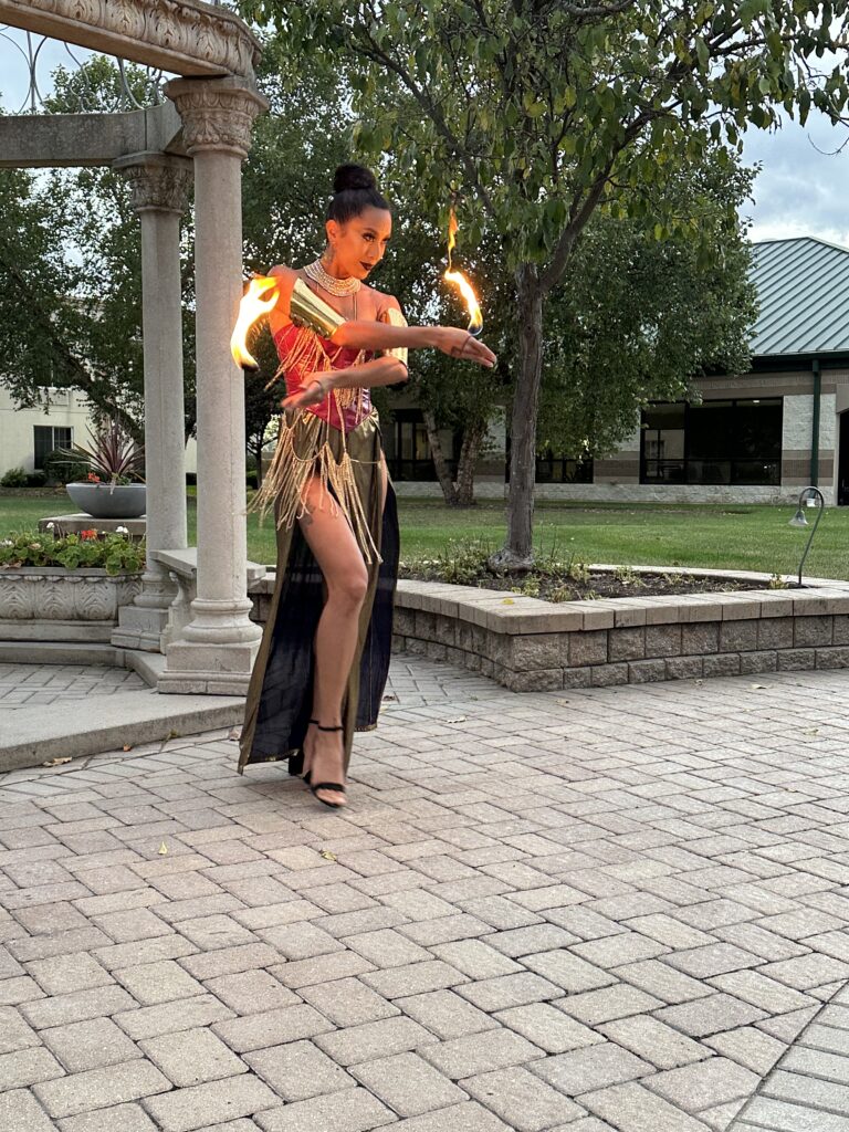 Luxury Outdoor Fire Performance Option | Corporate Gala Entertainment Chicago Vaudezilla Professional fire performer during upscale outdoor corporate entertainment experience in Chicago area