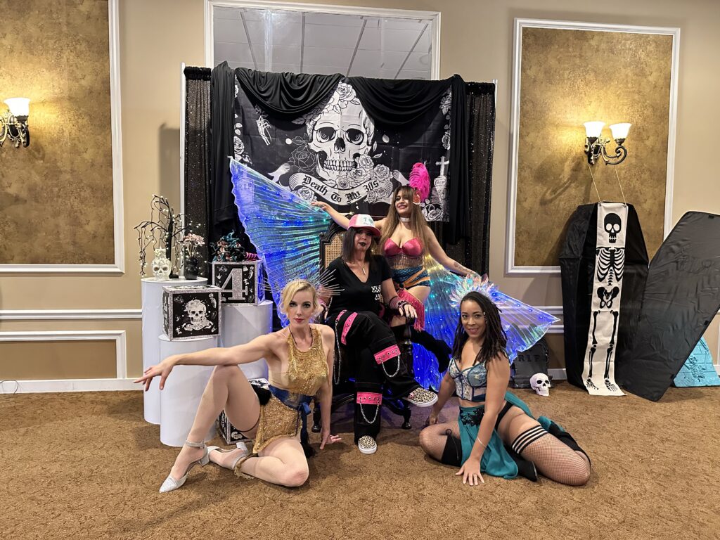 Immersive Cabaret Guest Experience | Themed Corporate Entertainment Environment Vaudezilla Interactive themed cabaret performers posing inside immersive corporate event environment