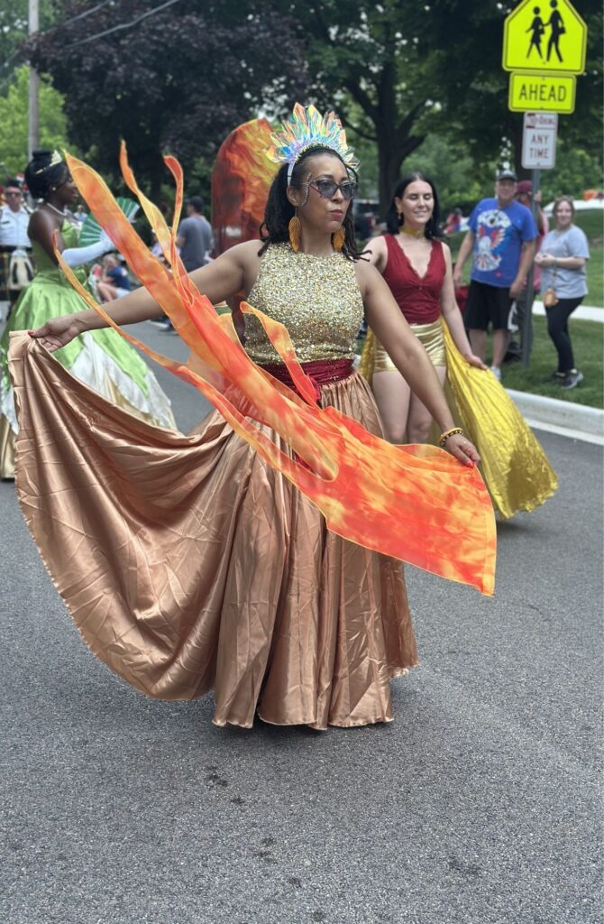 Interactive Firefly performers greeting spectators during a Chicago area community festival