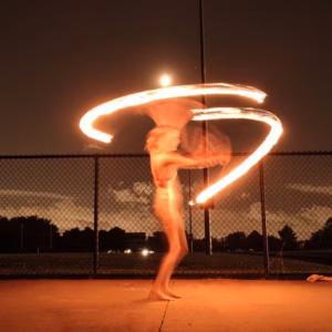 Chicago Fire Performers for Corporate Events Vaudezilla Chicago fire performers entertaining guests during a luxury corporate gala with a choreographed fire performance