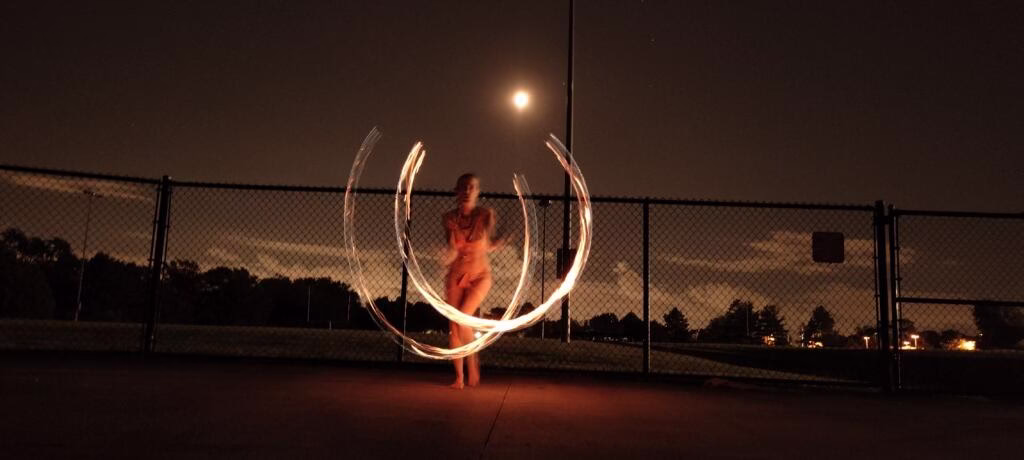 Fire performers welcoming guests at a luxury outdoor reception with elegant live fire entertainment
