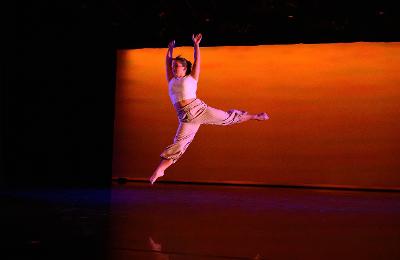 Ella Narance Contemporary Dance Performance Vaudezilla Ella Narance performing a contemporary dance leap onstage
