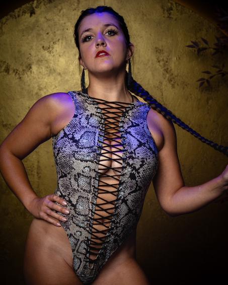 Emma Lucia | Chicago Aerialist Specialty Performer Vaudezilla Emma Lucia Chicago aerialist and specialty performer photographed in a snakeskin performance costume