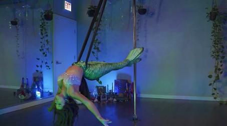 Emma Lucia | Pole Physical Theatre Performer Vaudezilla Emma Lucia performing pole and physical theatre in a mermaid costume